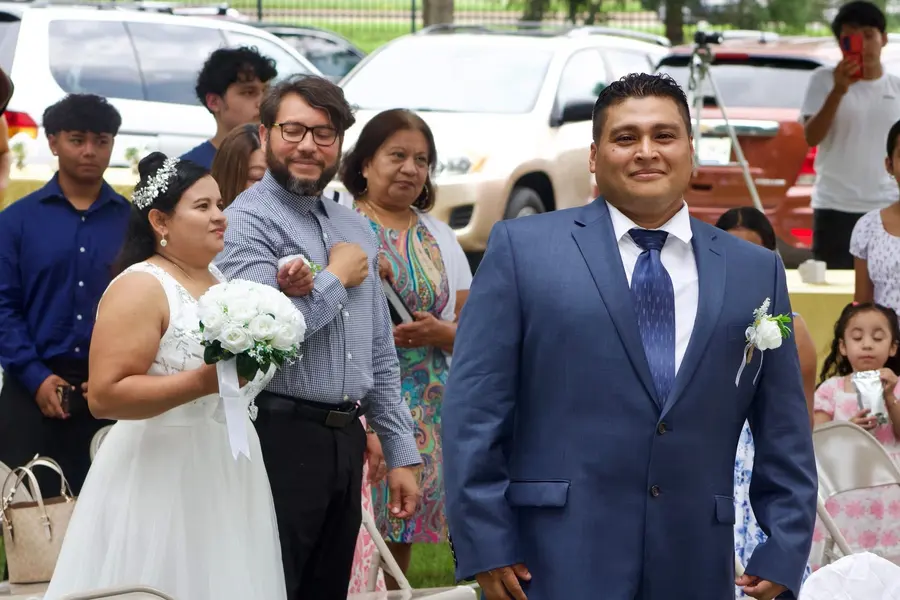 Wedding couple with family after the ceremony